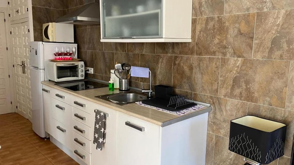 Kitchen or kitchenette, stove