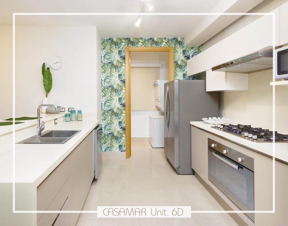Kitchen or kitchenette, dishwasher, oven, laundry, washing machine, dryer