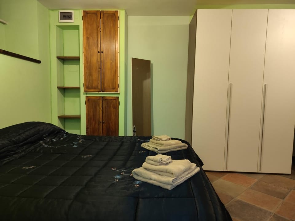 Bed, towels, wardrobe