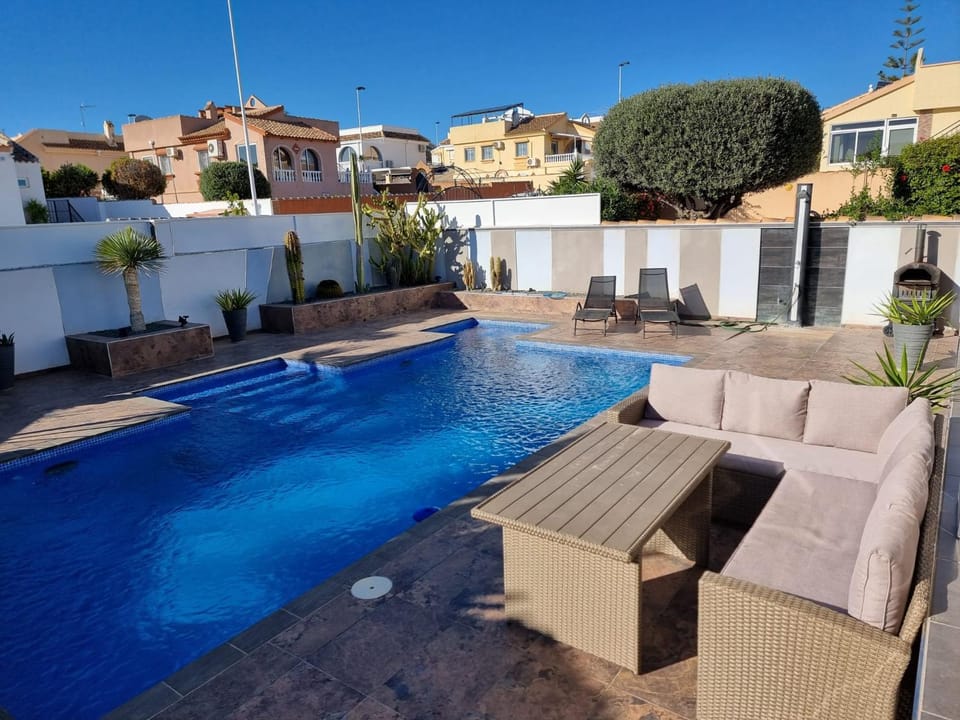 Property building, Patio, Seating area, Pool view, Swimming pool, sunbed