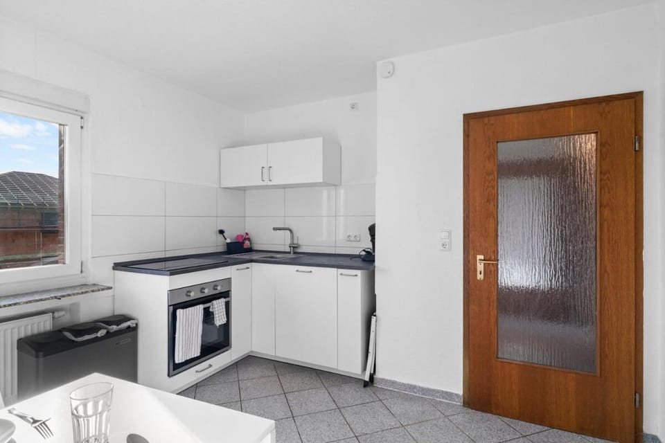 Kitchen or kitchenette, dishwasher, oven, stove