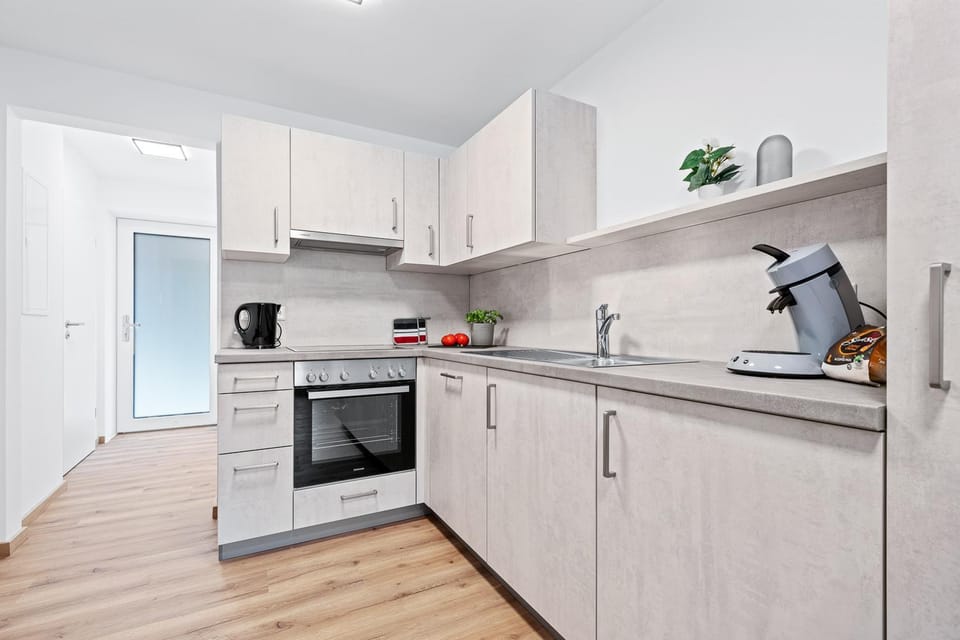 Kitchen or kitchenette, dishwasher, oven, stove