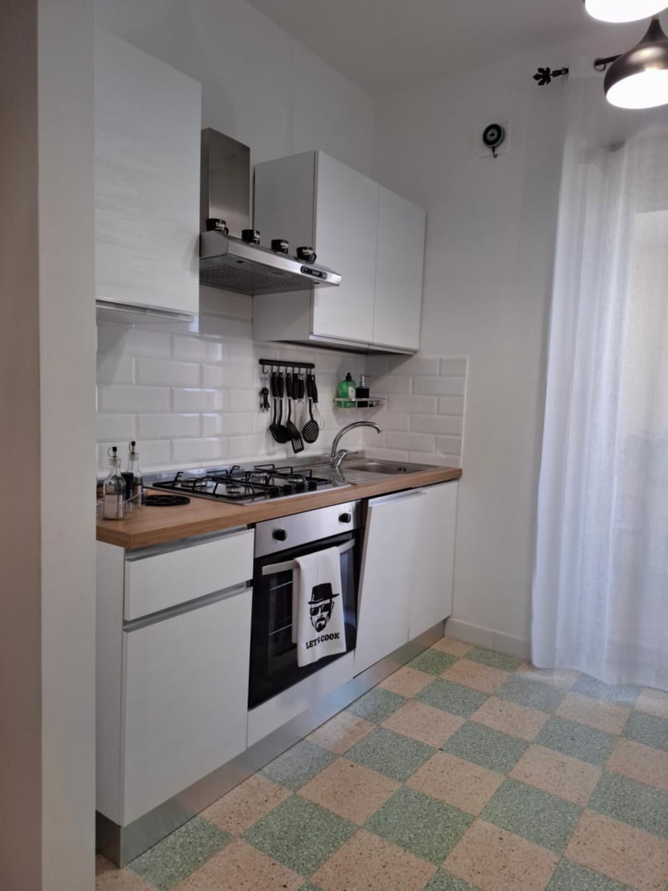 Kitchen or kitchenette, dishwasher, oven, stove