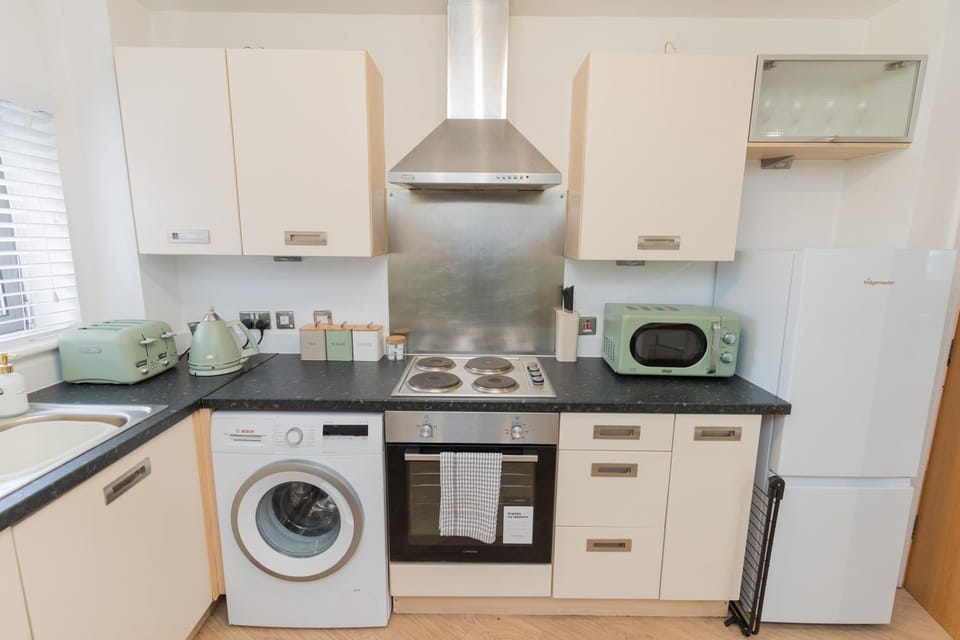 Communal kitchen, flat iron, microwave, washing machine