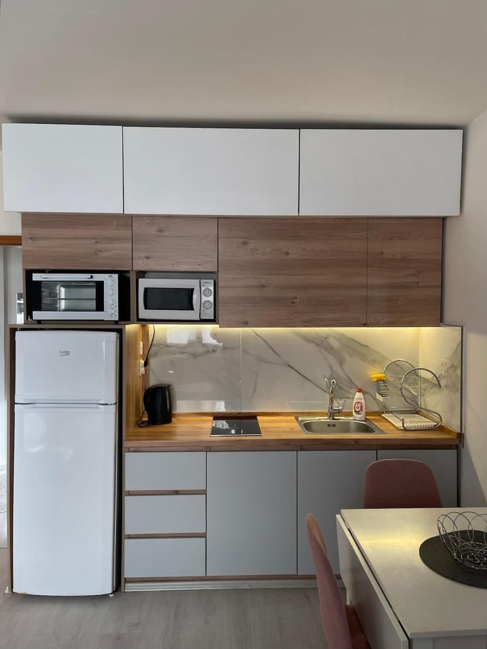 Kitchen or kitchenette, dishwasher, oven, stove