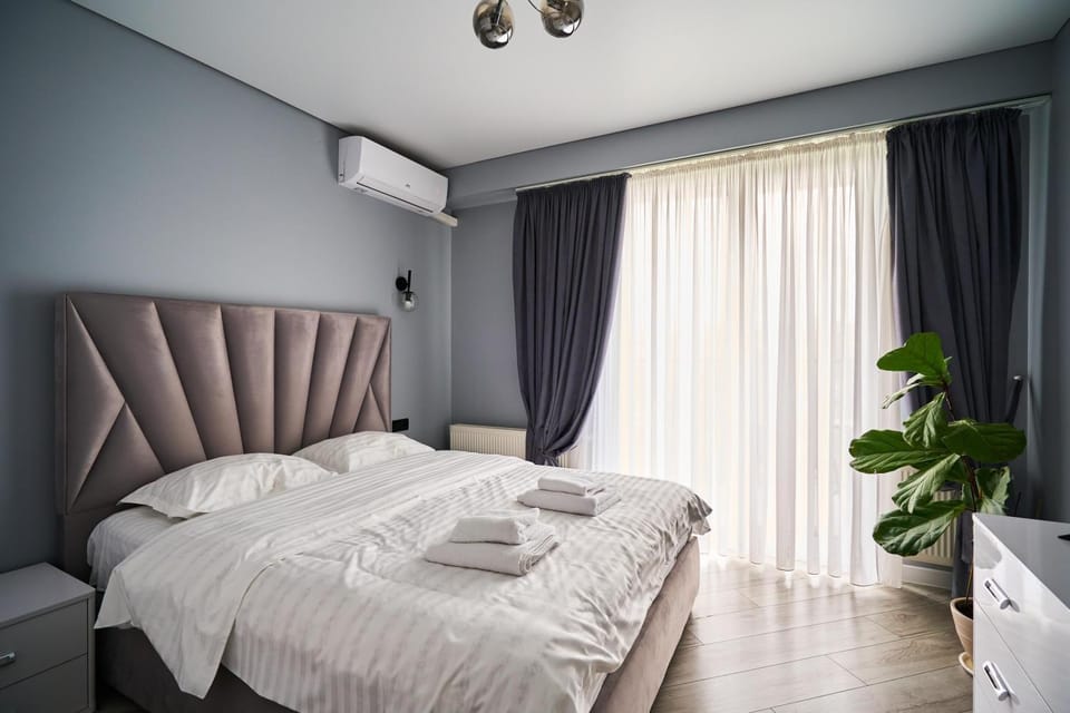 Bed, Photo of the whole room, Bedroom, towels, air conditioner