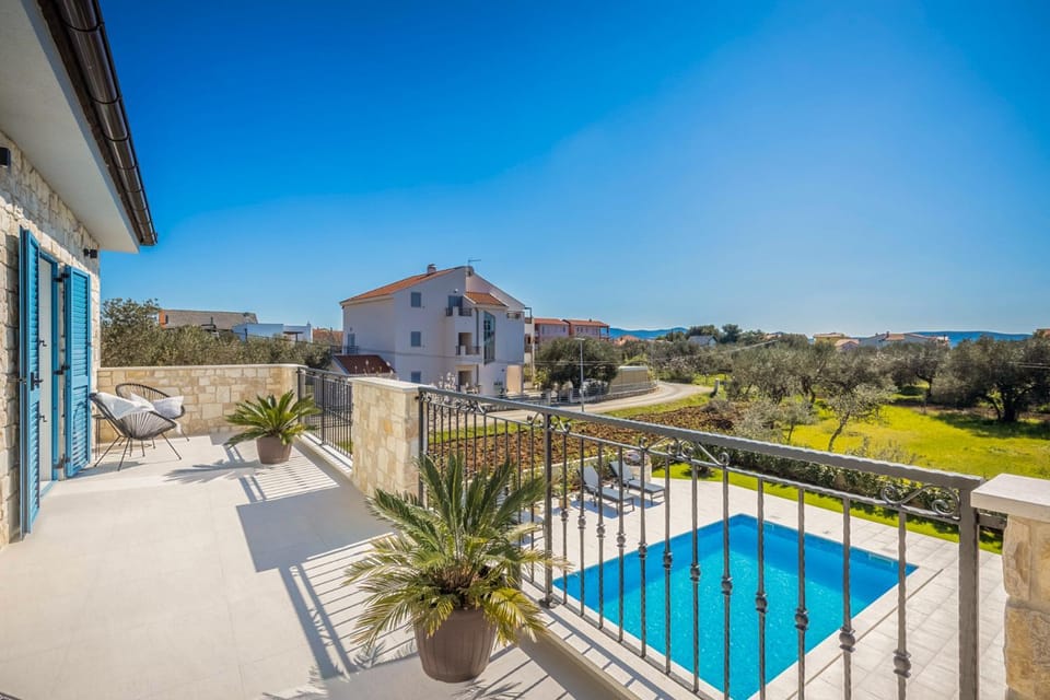 Property building, Patio, Spring, Day, Natural landscape, Balcony/Terrace, Pool view, Sea view, Swimming pool, sunbed