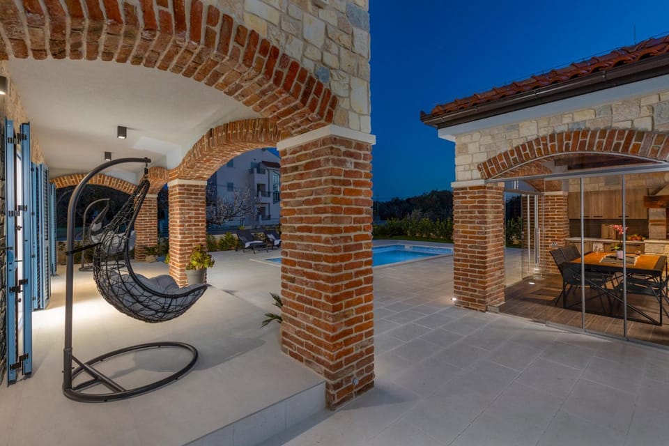 Patio, Night, Natural landscape, Seating area, Pool view, Swimming pool, sunbed