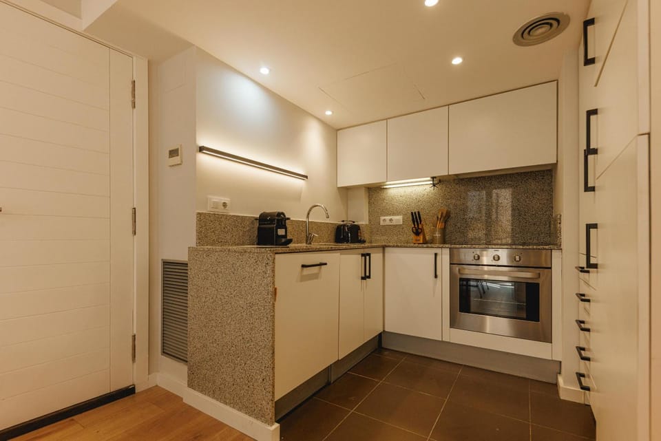 Kitchen or kitchenette, dishwasher, oven, stove, toaster