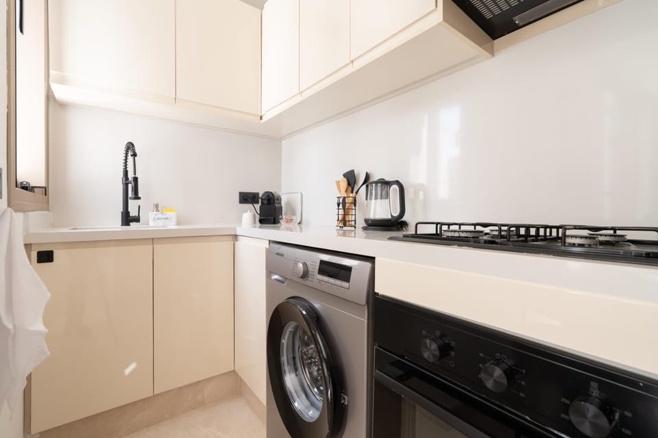 Kitchen or kitchenette, oven, stove, washing machine