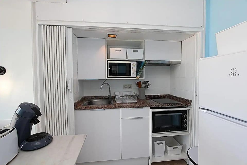 Kitchen or kitchenette, microwave, oven, stove, toaster