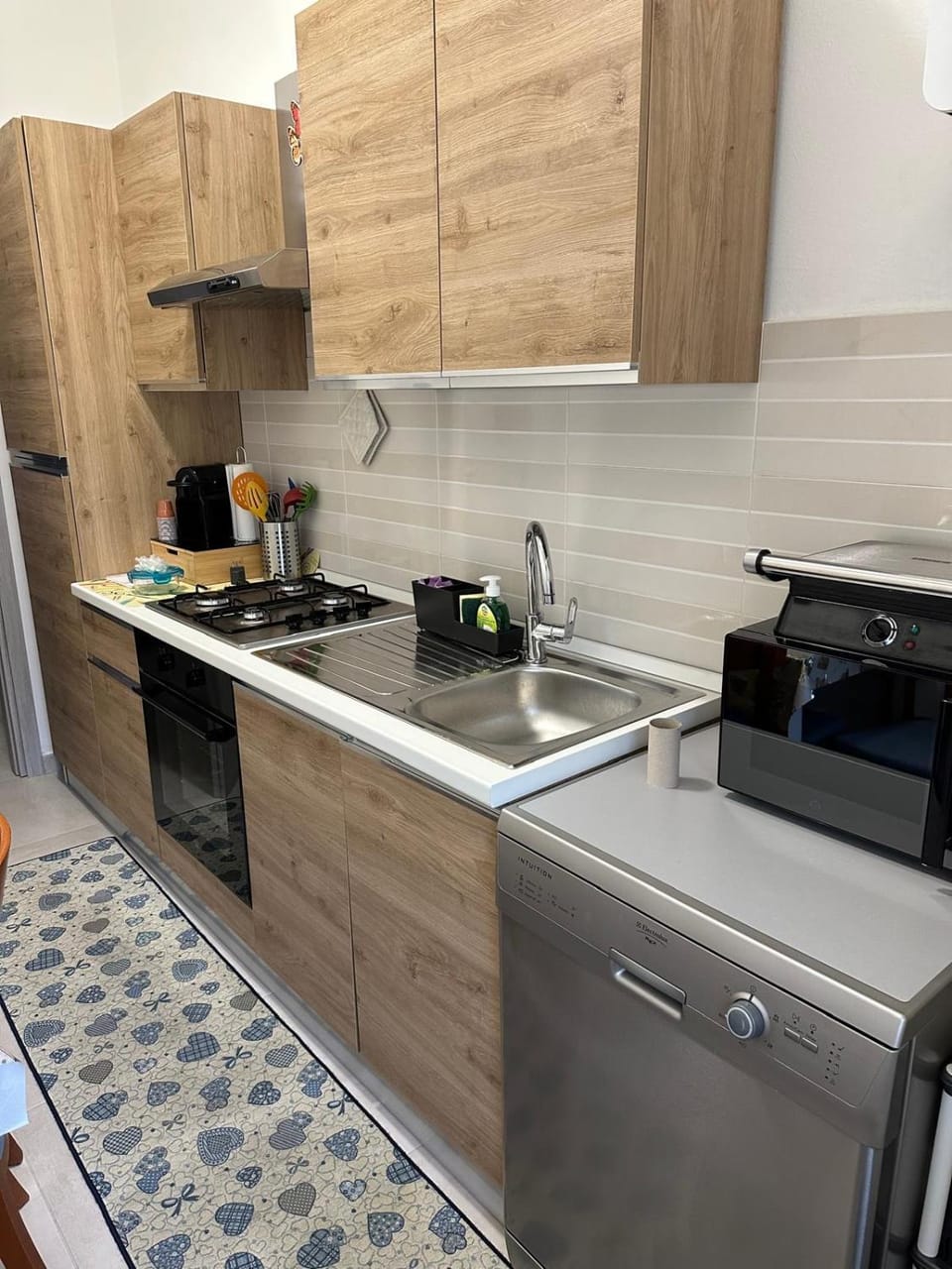 Kitchen or kitchenette, dishwasher, oven, stove
