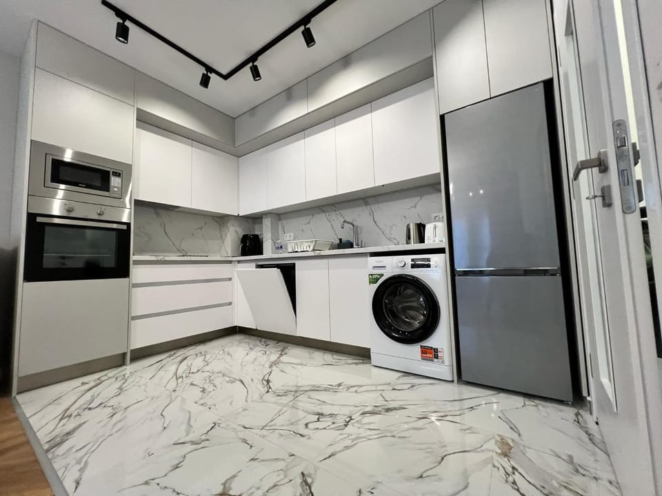 Kitchen or kitchenette, dishwasher, oven, stove