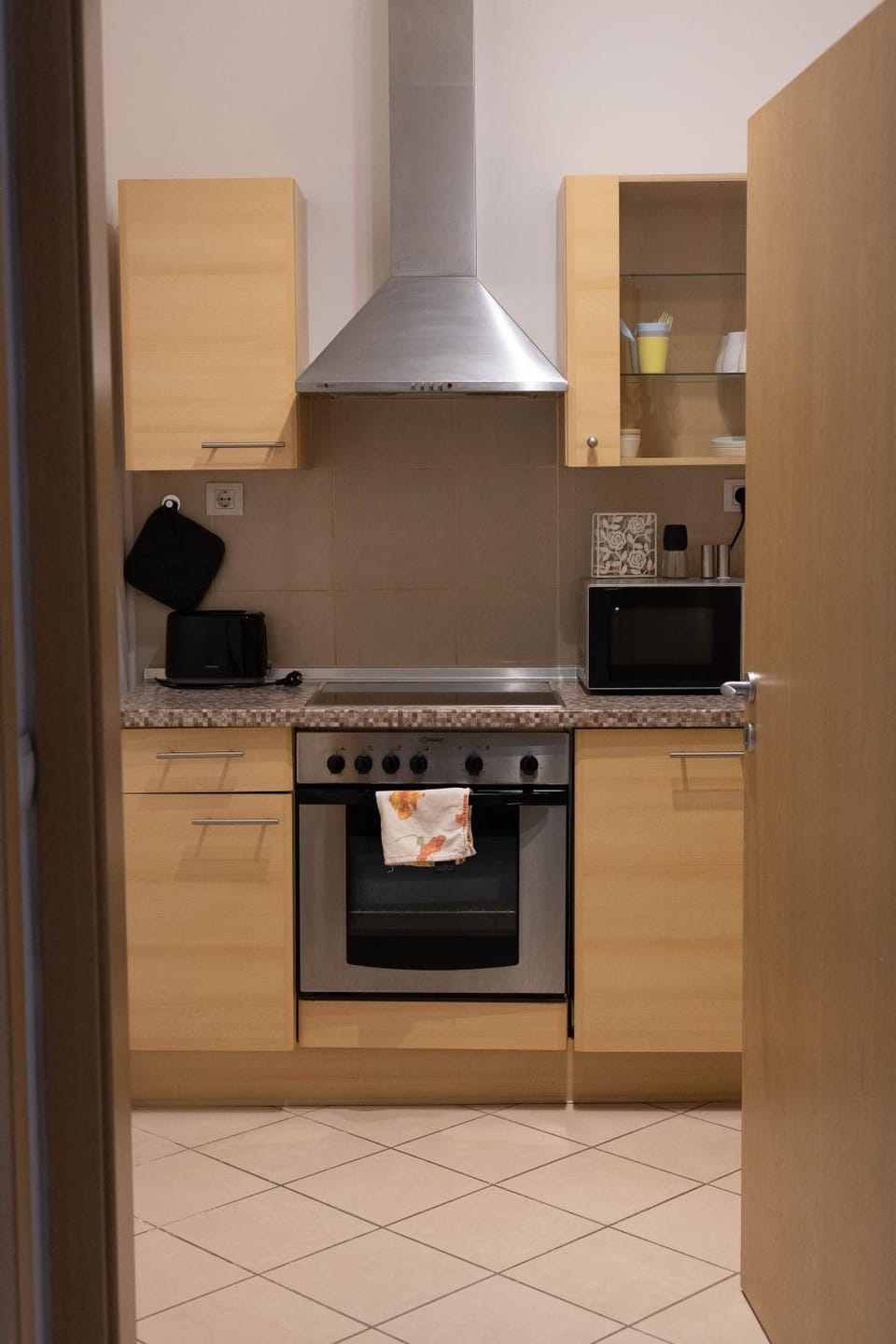 Kitchen or kitchenette, dishwasher, oven, stove