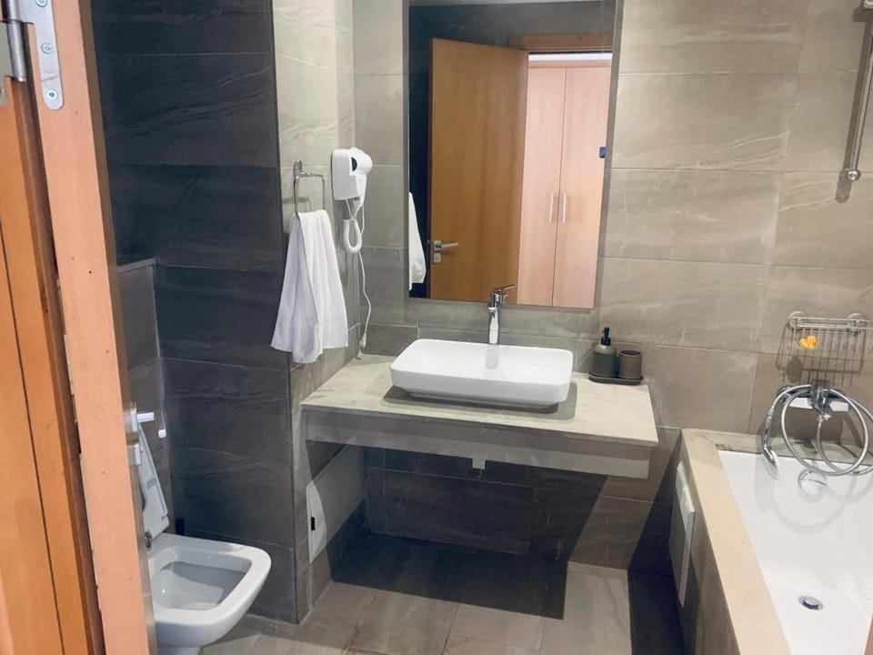 Shower, Toilet, Bathroom, hair dryier, towels