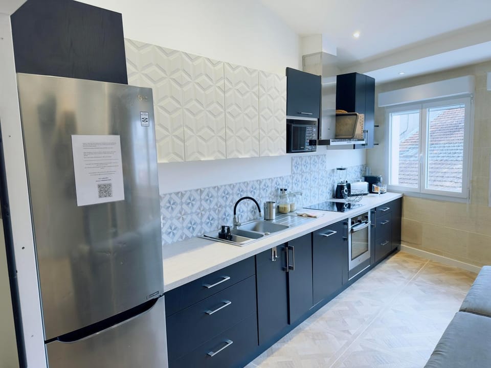 Kitchen or kitchenette, dishwasher, oven, stove