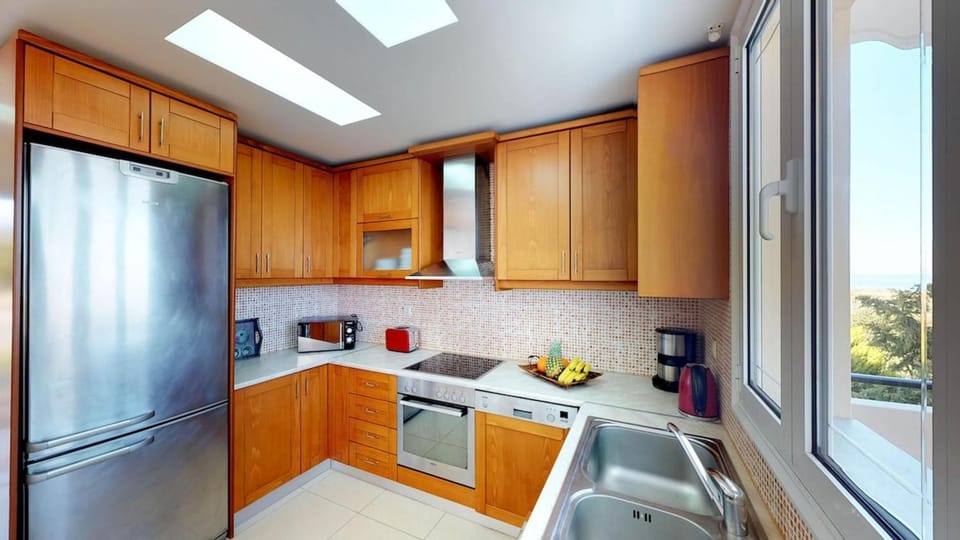 Kitchen or kitchenette, dishwasher, oven, stove