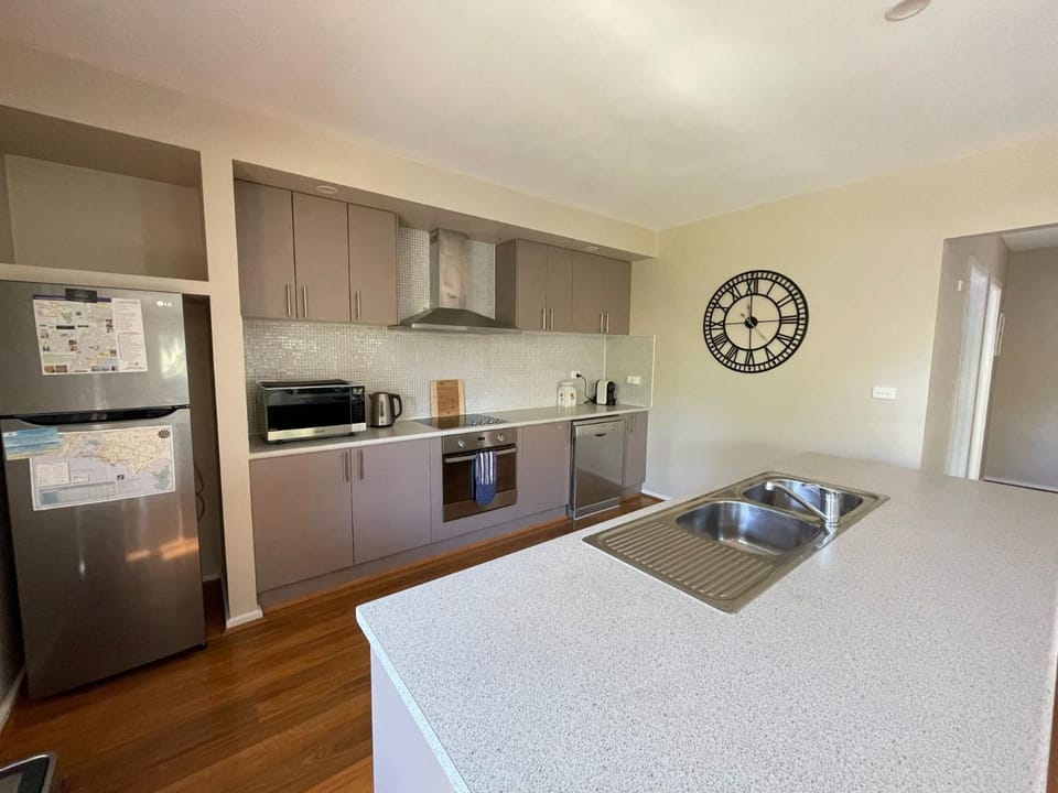 Kitchen or kitchenette, dishwasher, oven, stove