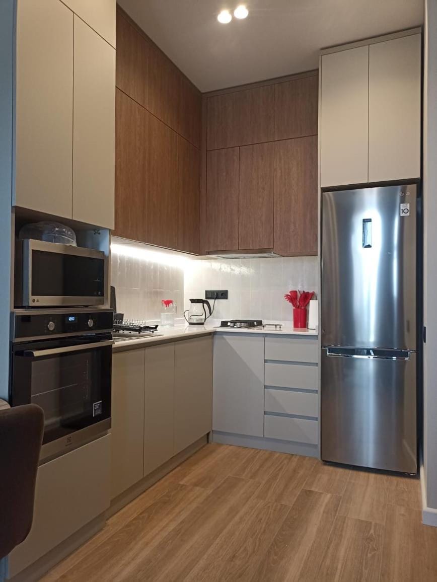 Kitchen or kitchenette, dishwasher, oven, stove