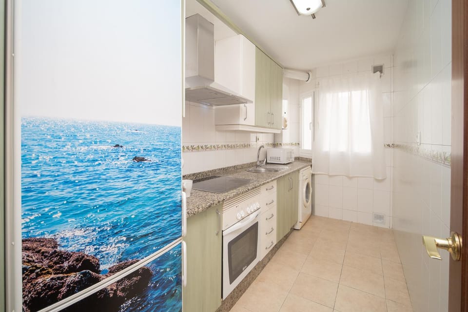 Kitchen or kitchenette, microwave, oven, stove