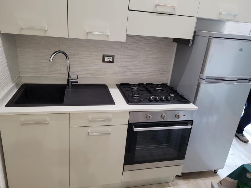 Kitchen or kitchenette, oven, stove