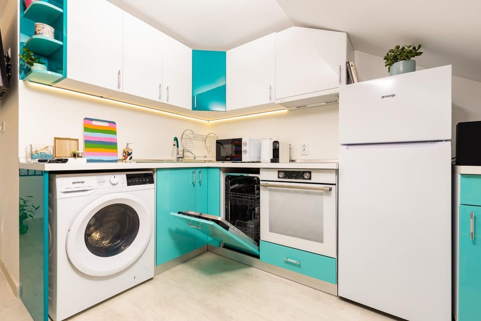 Kitchen or kitchenette, dishwasher, oven, stove, toaster, washing machine, dryer
