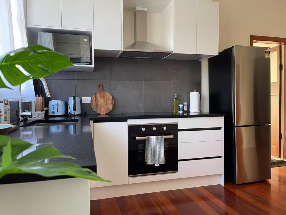 Kitchen or kitchenette, dishwasher, oven, stove, toaster