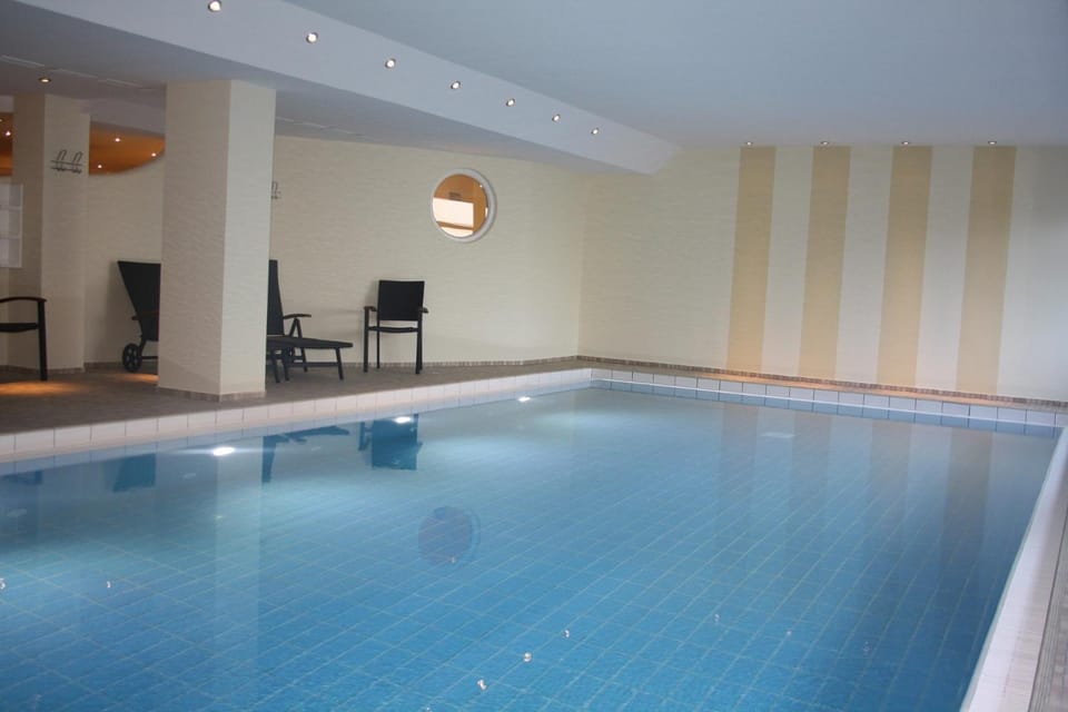 Property building, Living room, Swimming pool