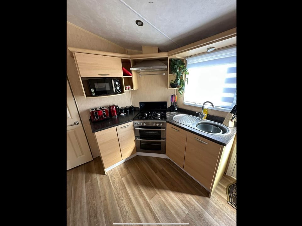 Kitchen or kitchenette, oven, stove, toaster