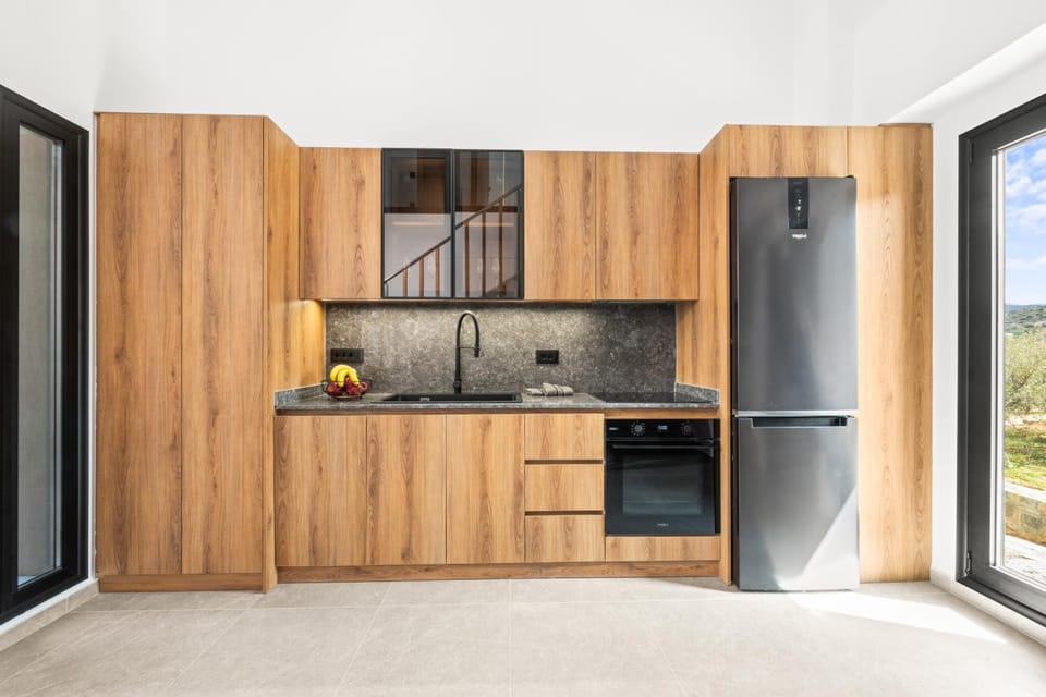 Kitchen or kitchenette, dishwasher, oven, stove