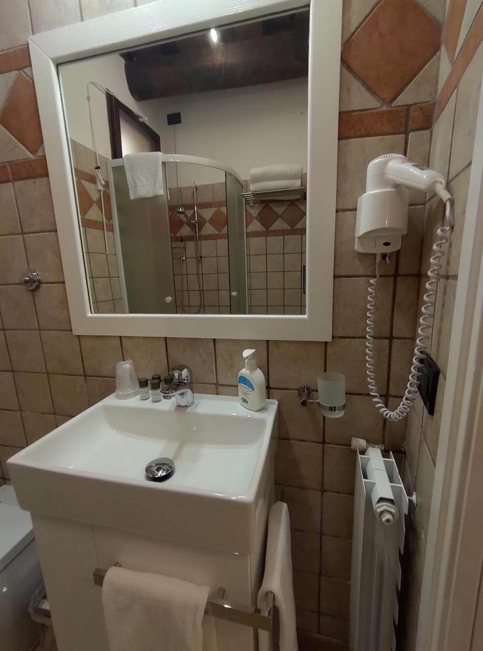 Shower, Toilet, Bathroom, hair dryier, towels