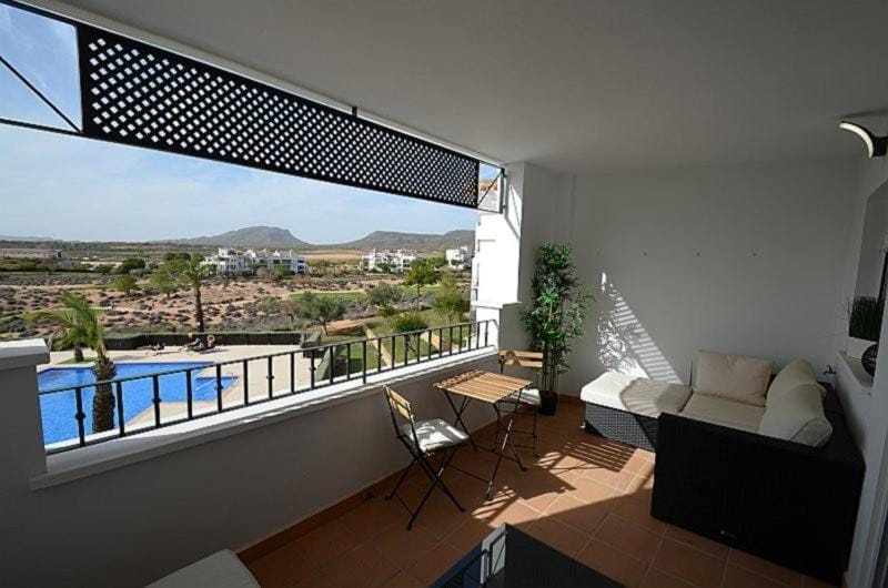 View (from property/room), Balcony/Terrace, Seating area, Mountain view, Pool view