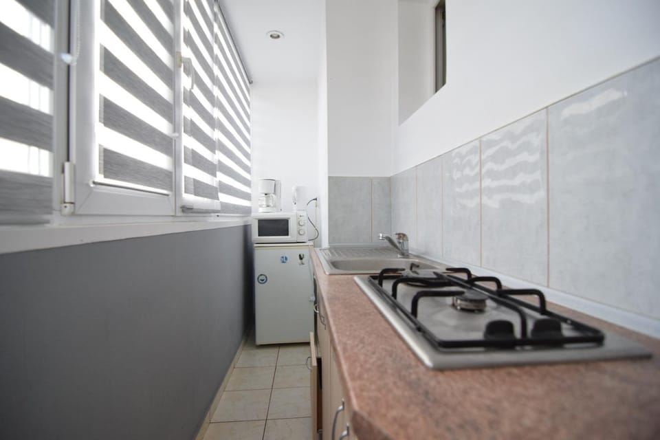 Kitchen or kitchenette, stove