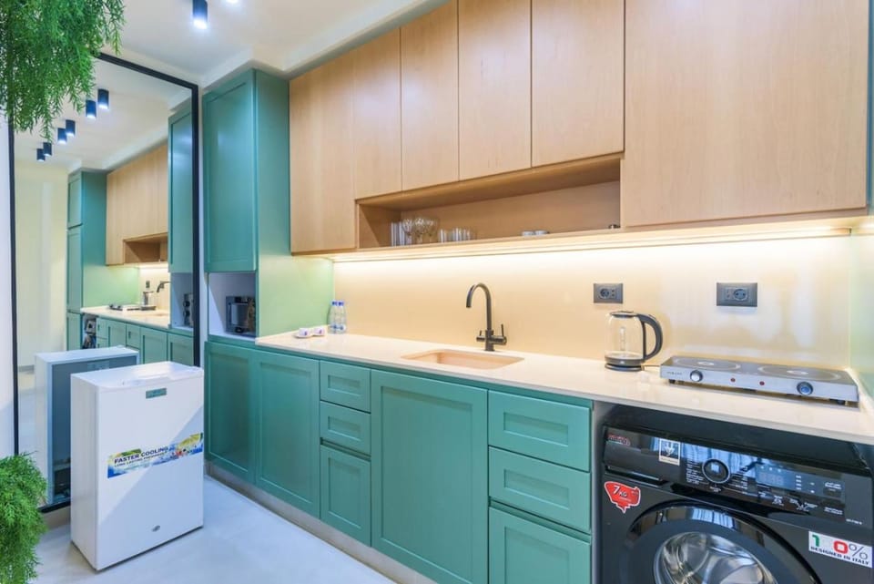 Kitchen or kitchenette, microwave, oven, stove