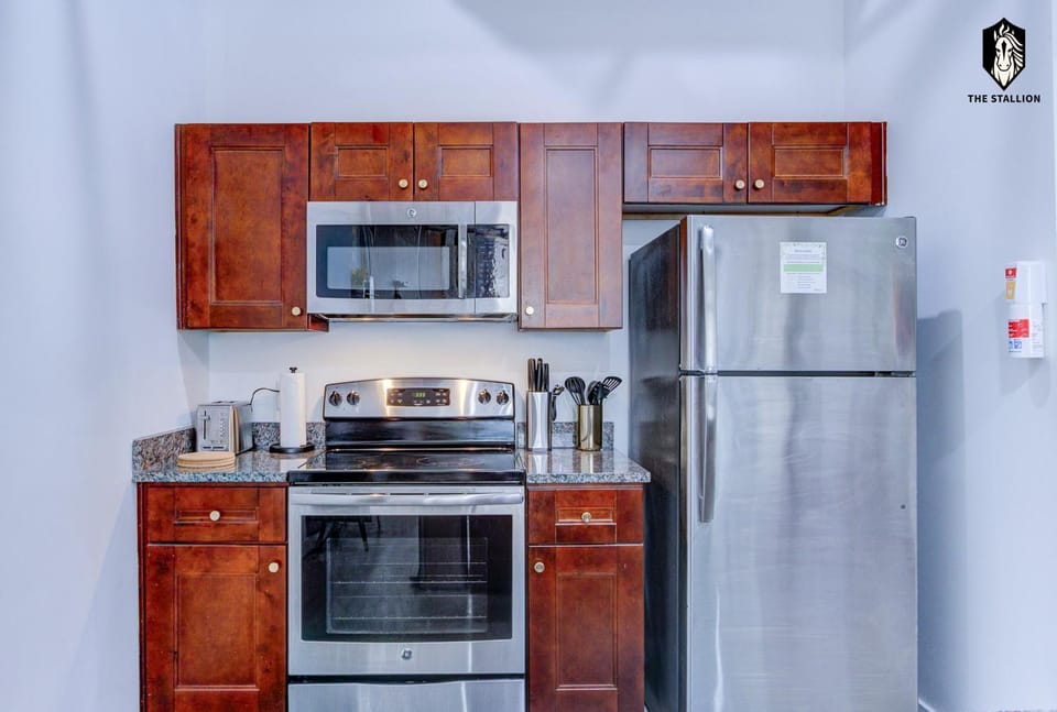 Kitchen or kitchenette, dishwasher, oven, stove, toaster