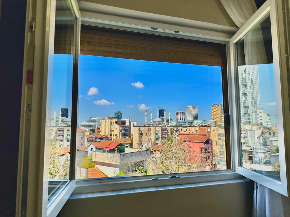 Property building, Day, View (from property/room), Living room, City view