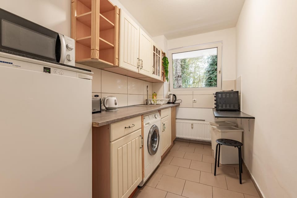 Kitchen or kitchenette, toaster, washing machine