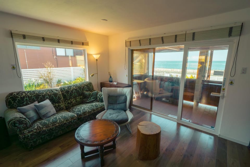 View (from property/room), Living room, Seating area, Sea view
