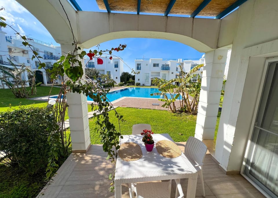 Property building, Patio, Spring, Day, Garden, View (from property/room), Balcony/Terrace, Dining area, Garden view, Pool view, Swimming pool