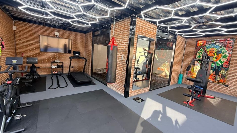 Modern Central 1 Bedroom Guesthouse -Bikes - Huge Patio - Gym - Pickleball Court House in Chapala