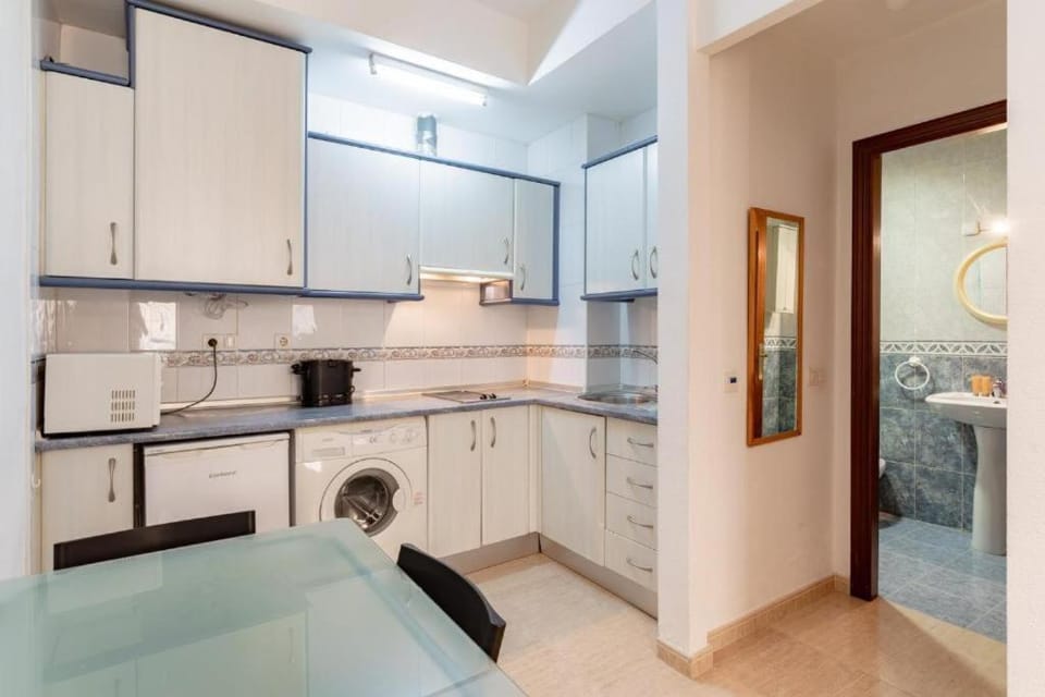 Kitchen or kitchenette, washing machine