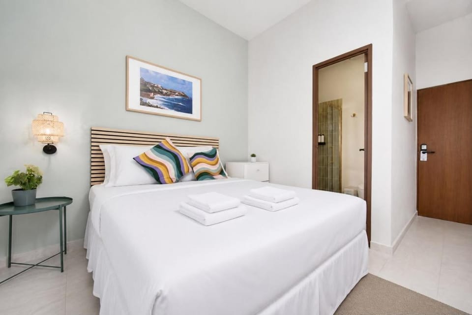 Room 12: Sunlit Balcony Stay w/ Free Parking | Calle Cerra Hotel in San Juan