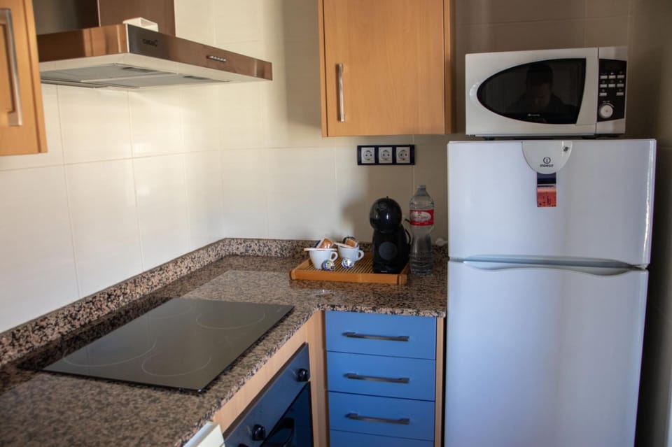 Kitchen or kitchenette, microwave, oven, stove, toaster