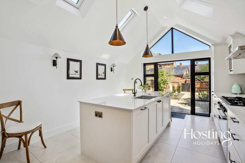 Kitchen or kitchenette, dishwasher, oven, stove