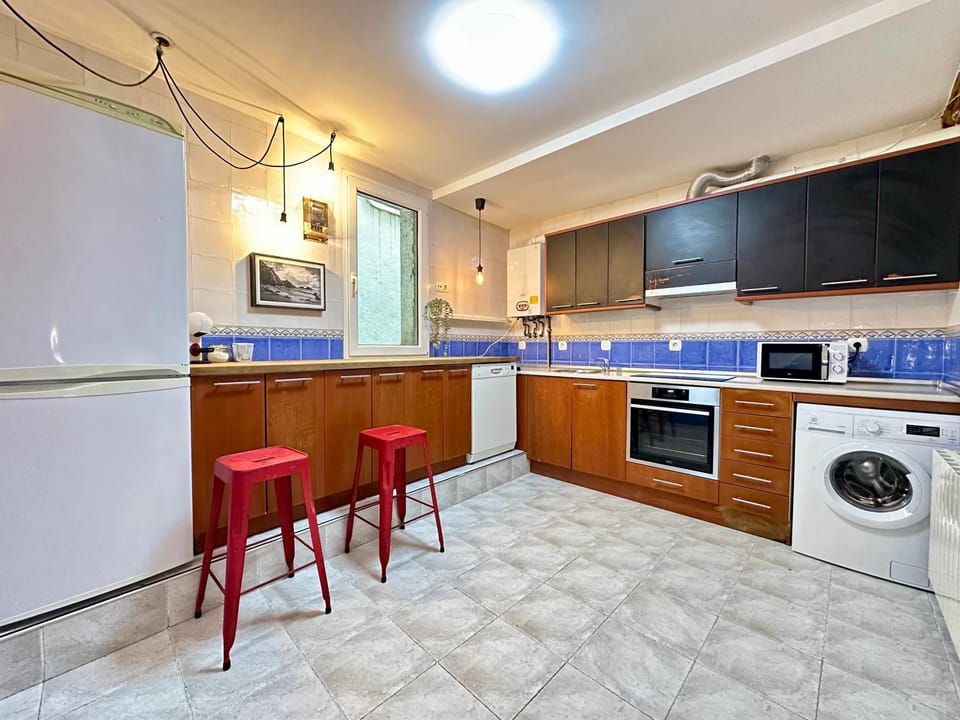 Kitchen or kitchenette, dishwasher, oven, stove, washing machine