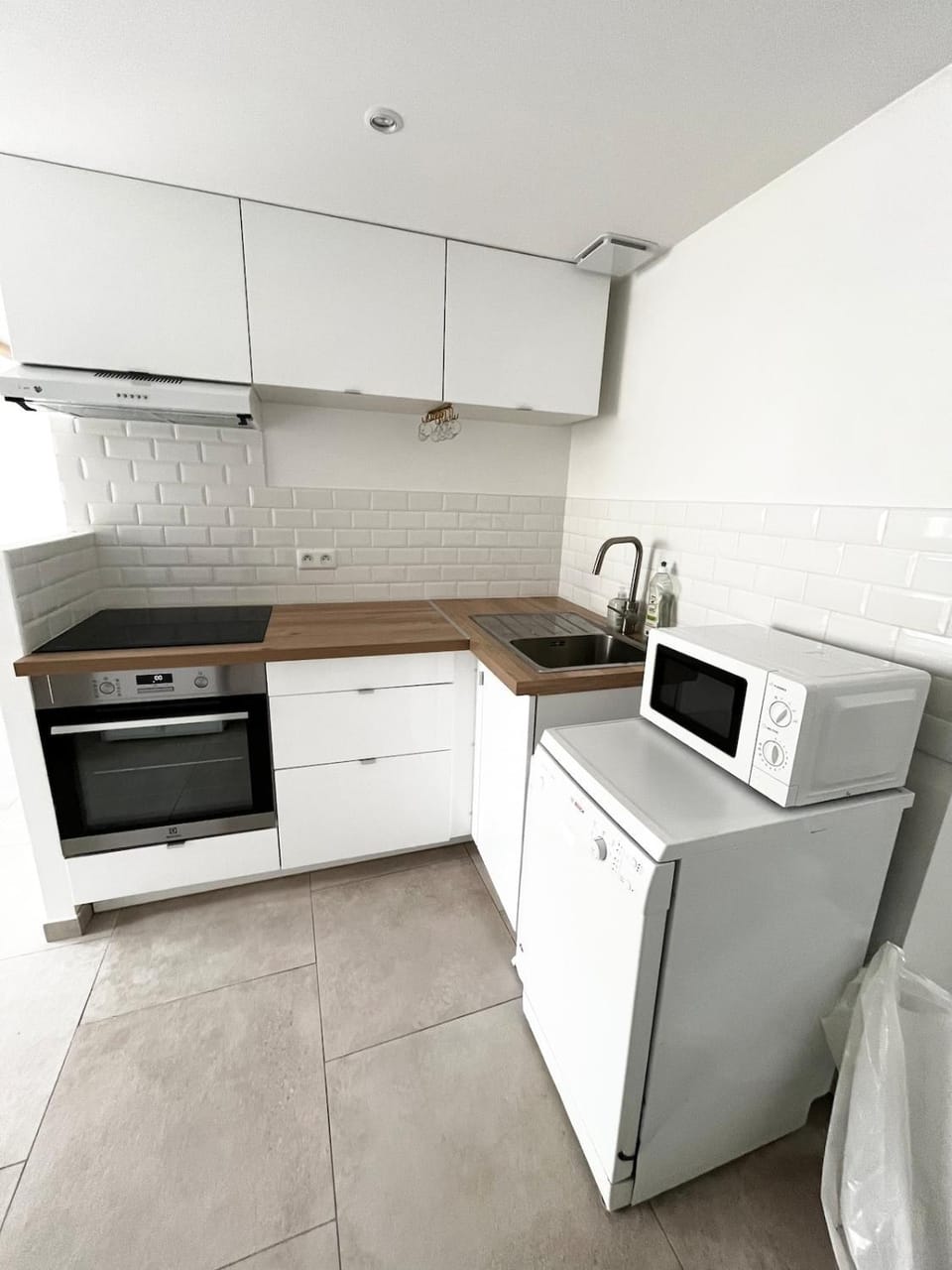 Kitchen or kitchenette, dishwasher, oven, stove, toaster