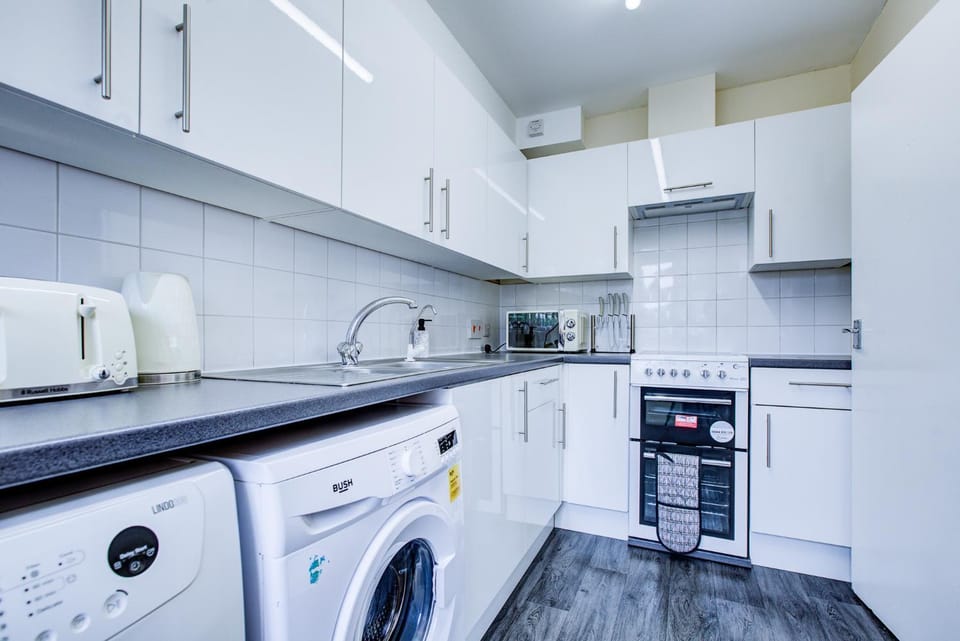 Kitchen or kitchenette, oven, stove, toaster, washing machine, dryer
