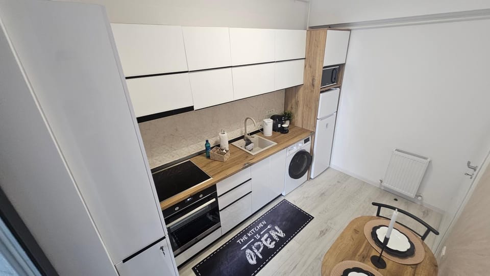 Kitchen or kitchenette, oven, stove, toaster, washing machine