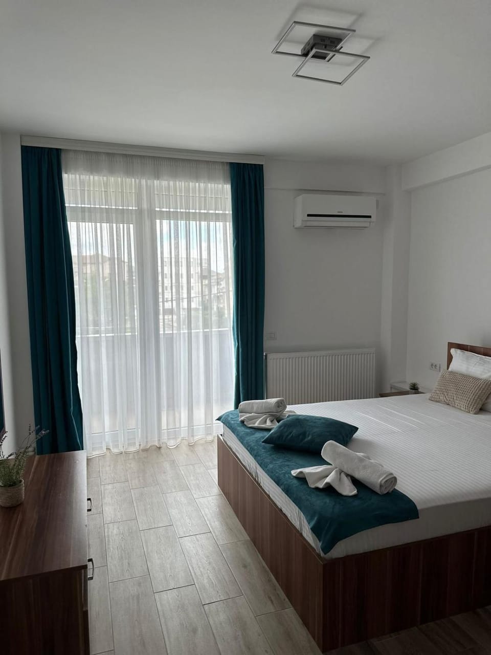 Bed, Photo of the whole room, Bedroom, towels, air conditioner