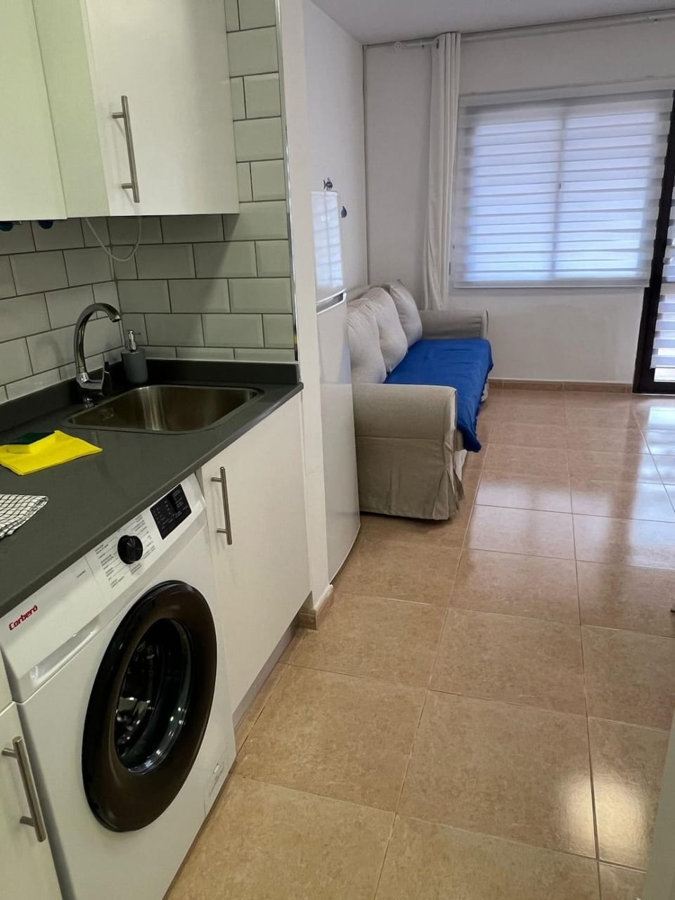 Kitchen or kitchenette, stove, washing machine